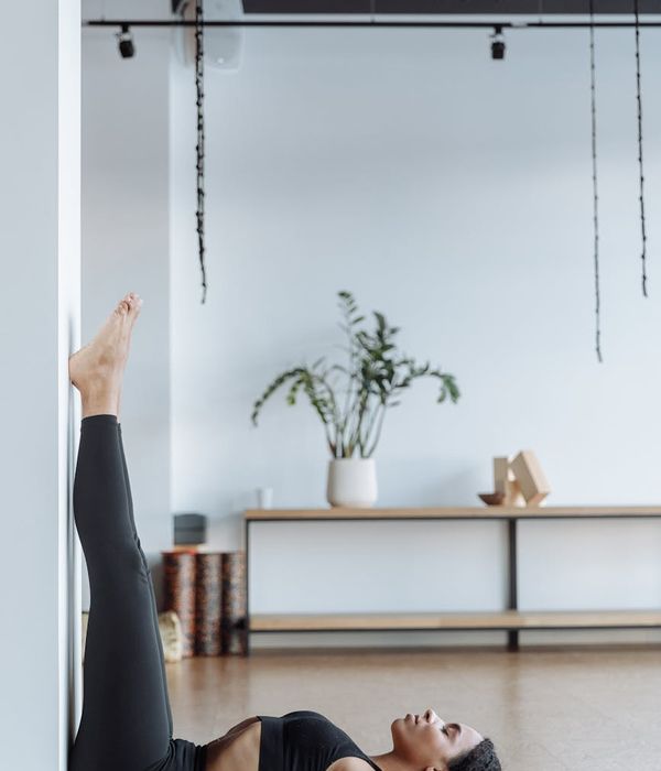 Mexican woman practicing peaceful hatha yoga poses in sunset light